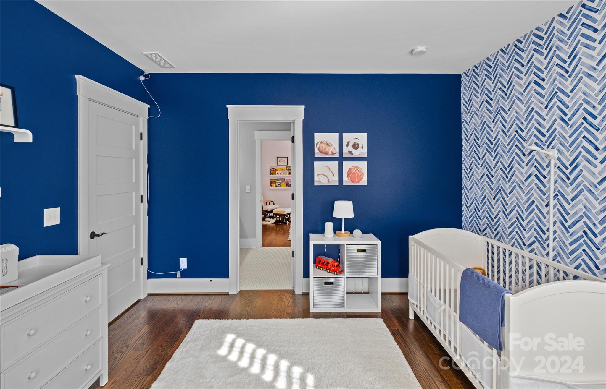 149 McAlway Road Charlotte, NC 28211 - Photo 33 of 48 a living room with furniture and a baby crib
