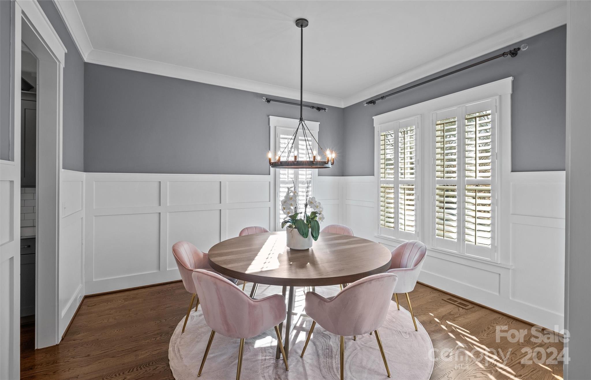 149 McAlway Road Charlotte, NC 28211 - Photo 4 of 48 a dining room with furniture a chandelier and wooden floor