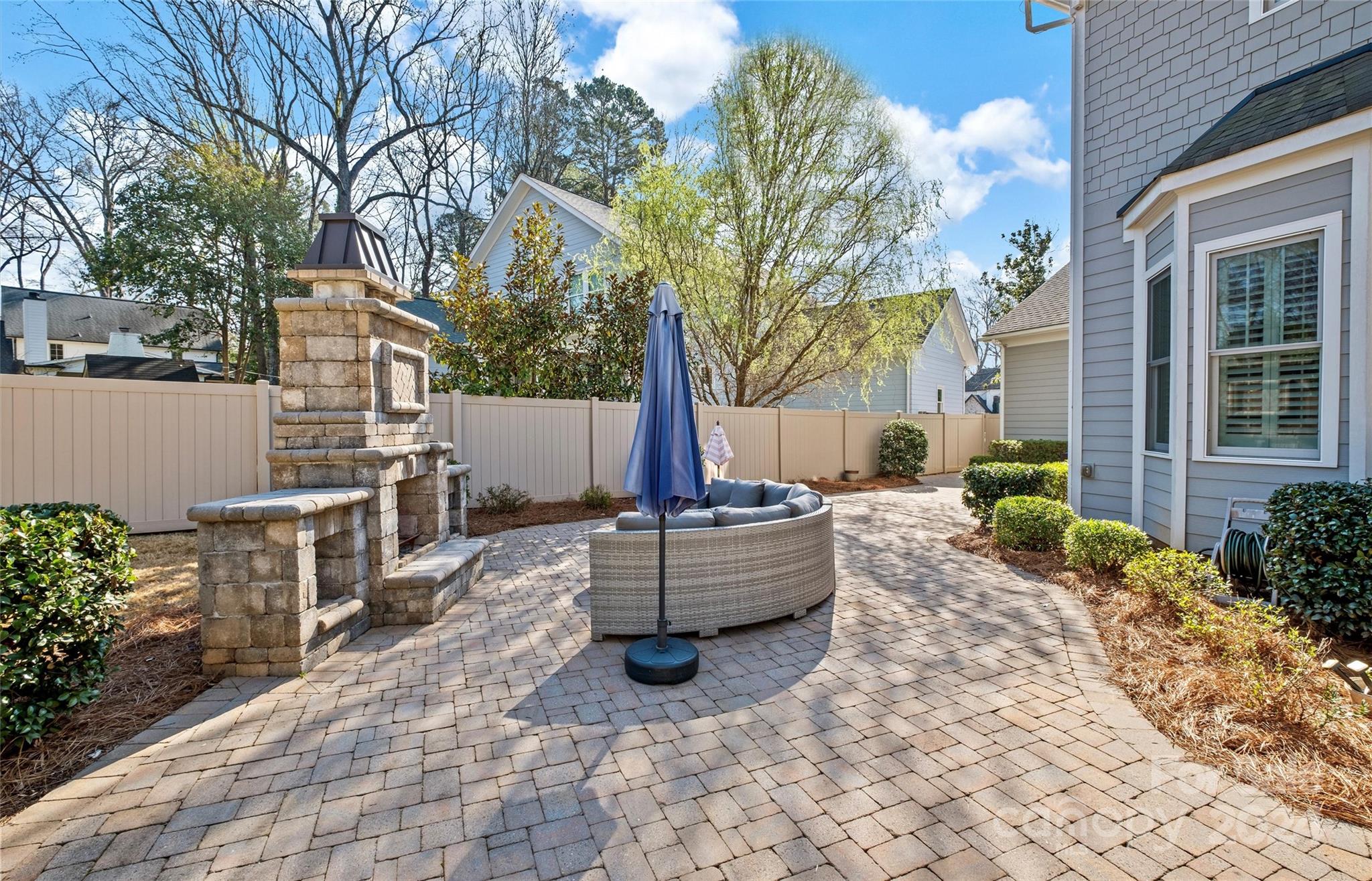 149 McAlway Road Charlotte, NC 28211 - Photo 42 of 48 a view of a patio with couches and table and chairs and potted plants