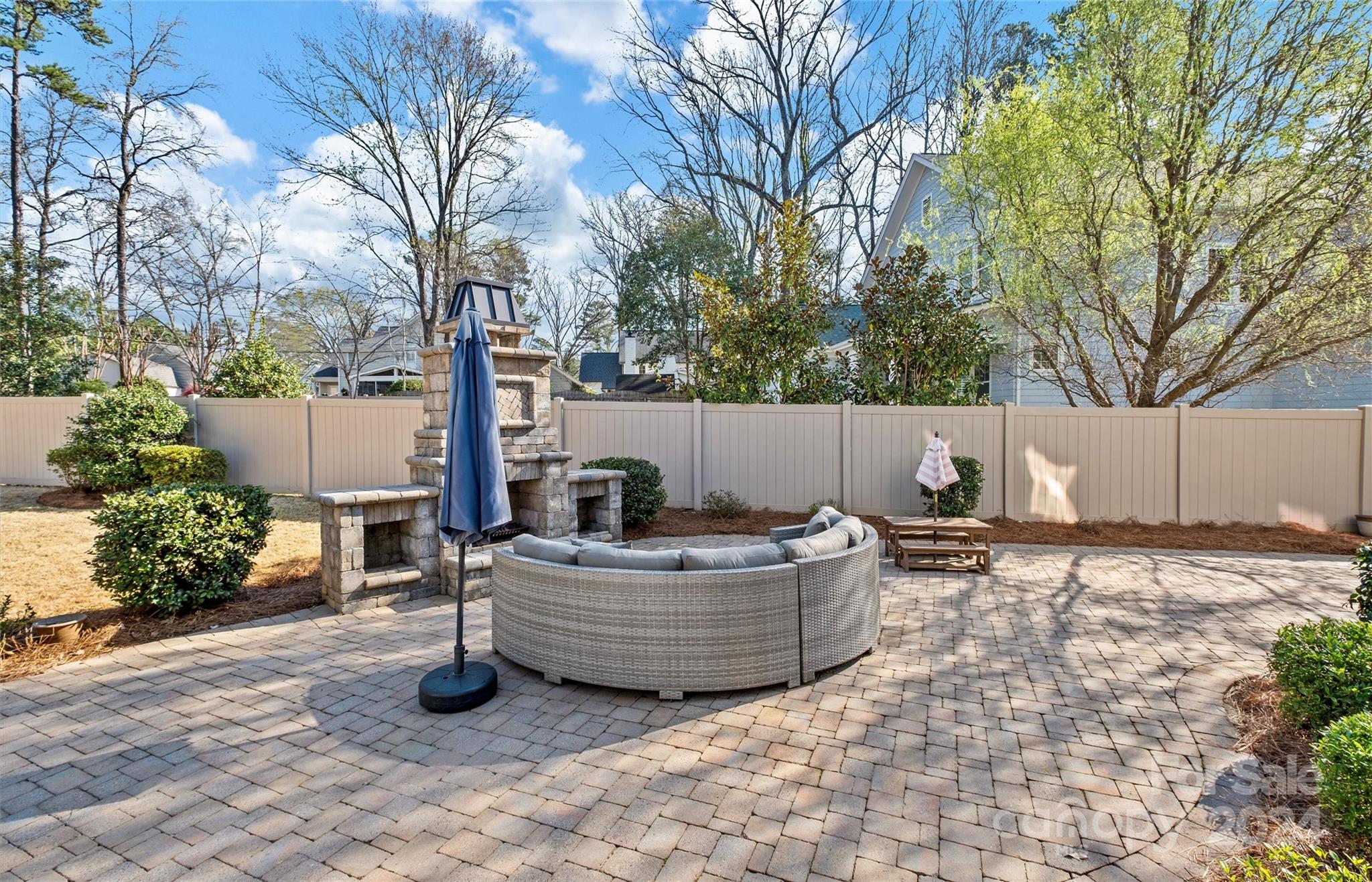 149 McAlway Road Charlotte, NC 28211 - Photo 43 of 48 a backyard of a house with fountain and outdoor seating