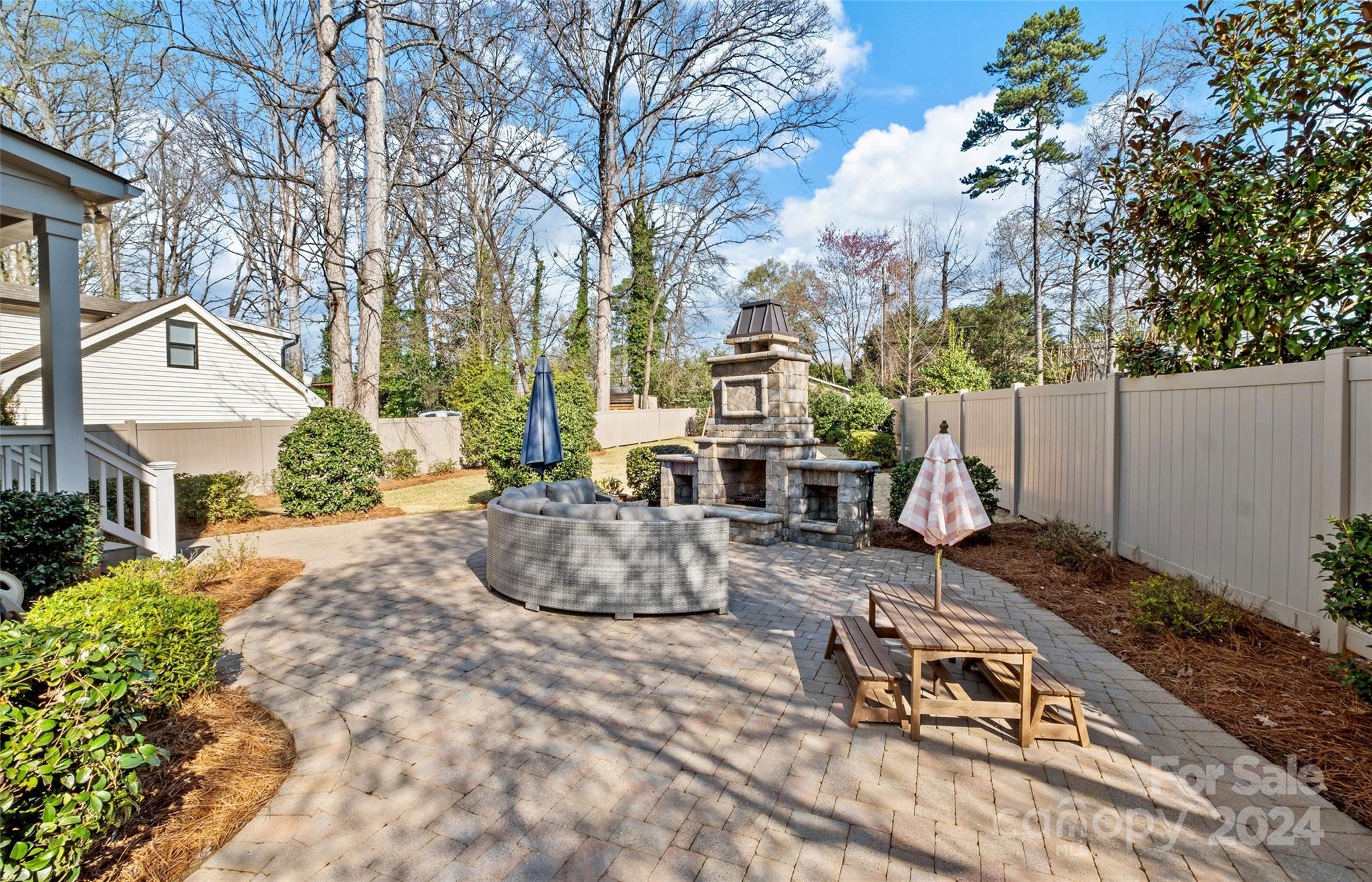 149 McAlway Road Charlotte, NC 28211 - Photo 45 of 48 a backyard of a house with table and chairs