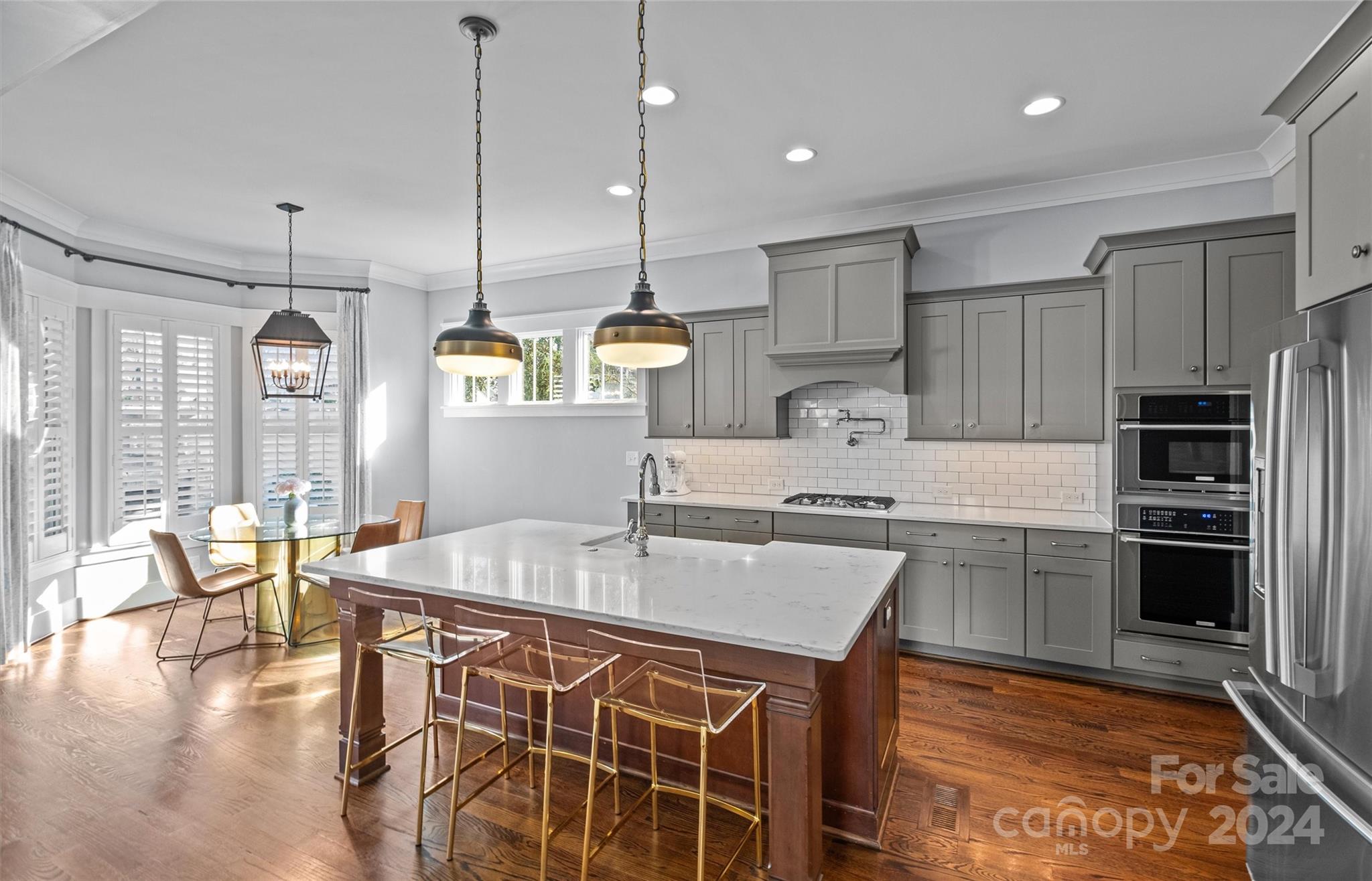 149 McAlway Road Charlotte, NC 28211 - Photo 10 of 48 a kitchen with kitchen island granite countertop a sink counter and chairs