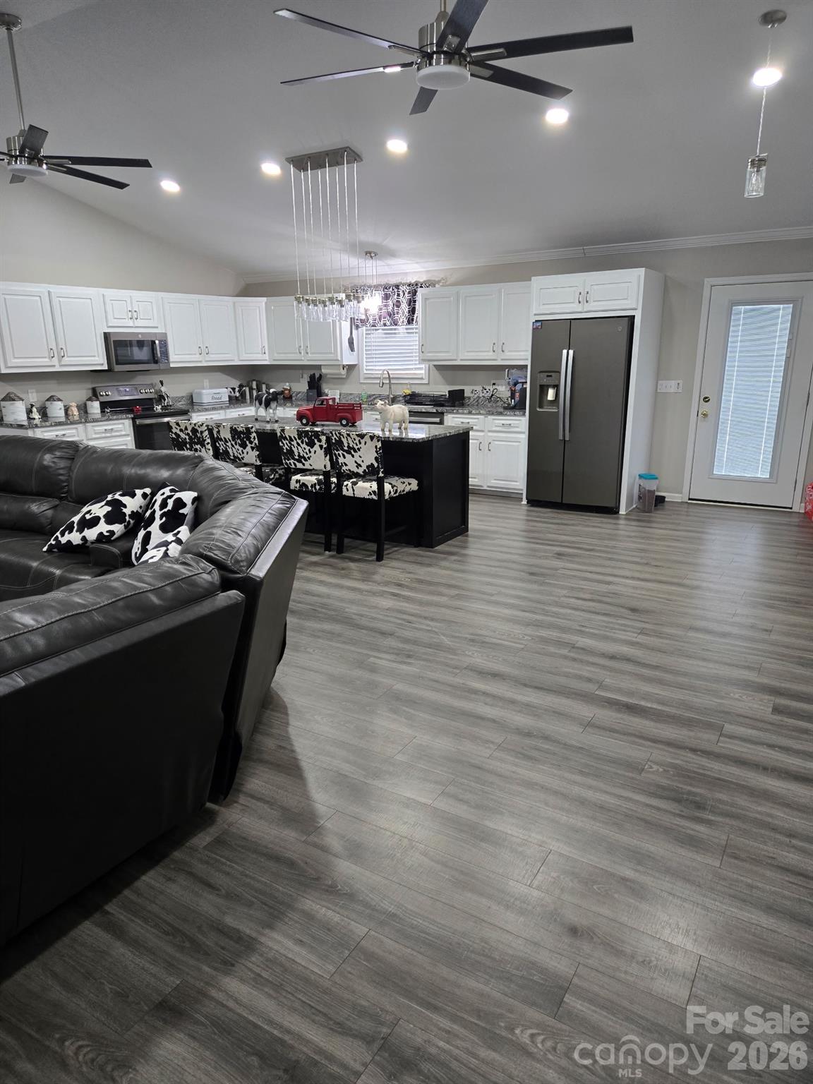 147 Black Bottom Road Union, SC 29379 - Photo 7 of 23 a kitchen with stainless steel appliances granite countertop a sink a stove and a wooden floors
