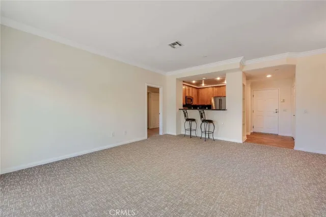 a view of a livingroom with furniture and a window