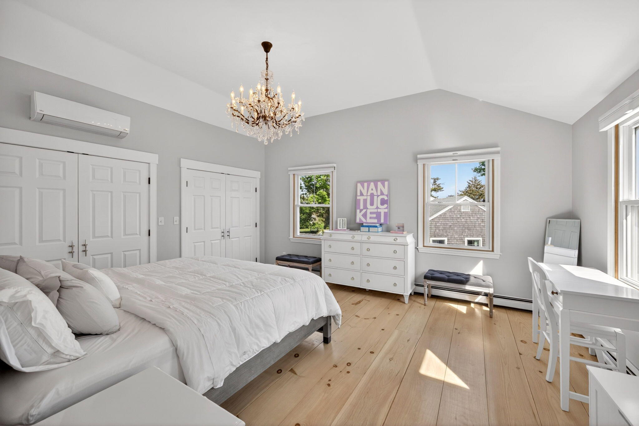 320 Old Harbor Road Chatham, MA 02633 - Photo 38 of 58 a spacious bedroom with a bed and a chandelier