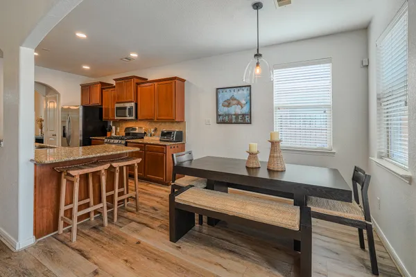 a kitchen with sink cabinets and wooden floor