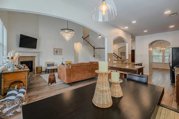 a living room with fireplace furniture and a flat screen tv