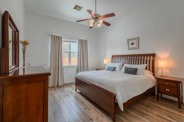 a bedroom with bed and window