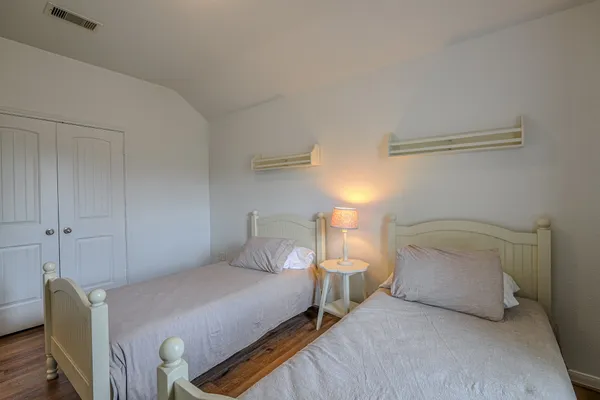 a bedroom with a bed and a chair