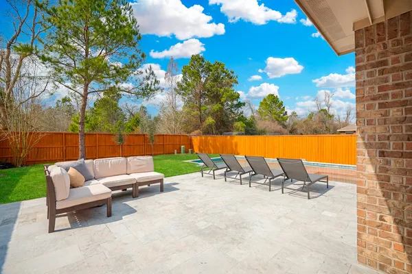 a view of swimming pool with lounge chair