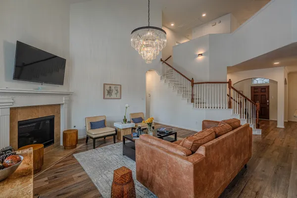 a living room with furniture and a fireplace
