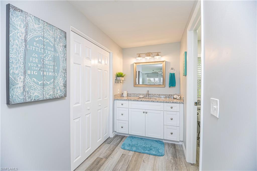 4 Chateau Way Naples, FL 34112 - Photo 13 of 21 a bathroom with a sink and a mirror