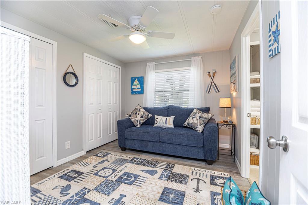4 Chateau Way Naples, FL 34112 - Photo 17 of 21 a living room with furniture and a window