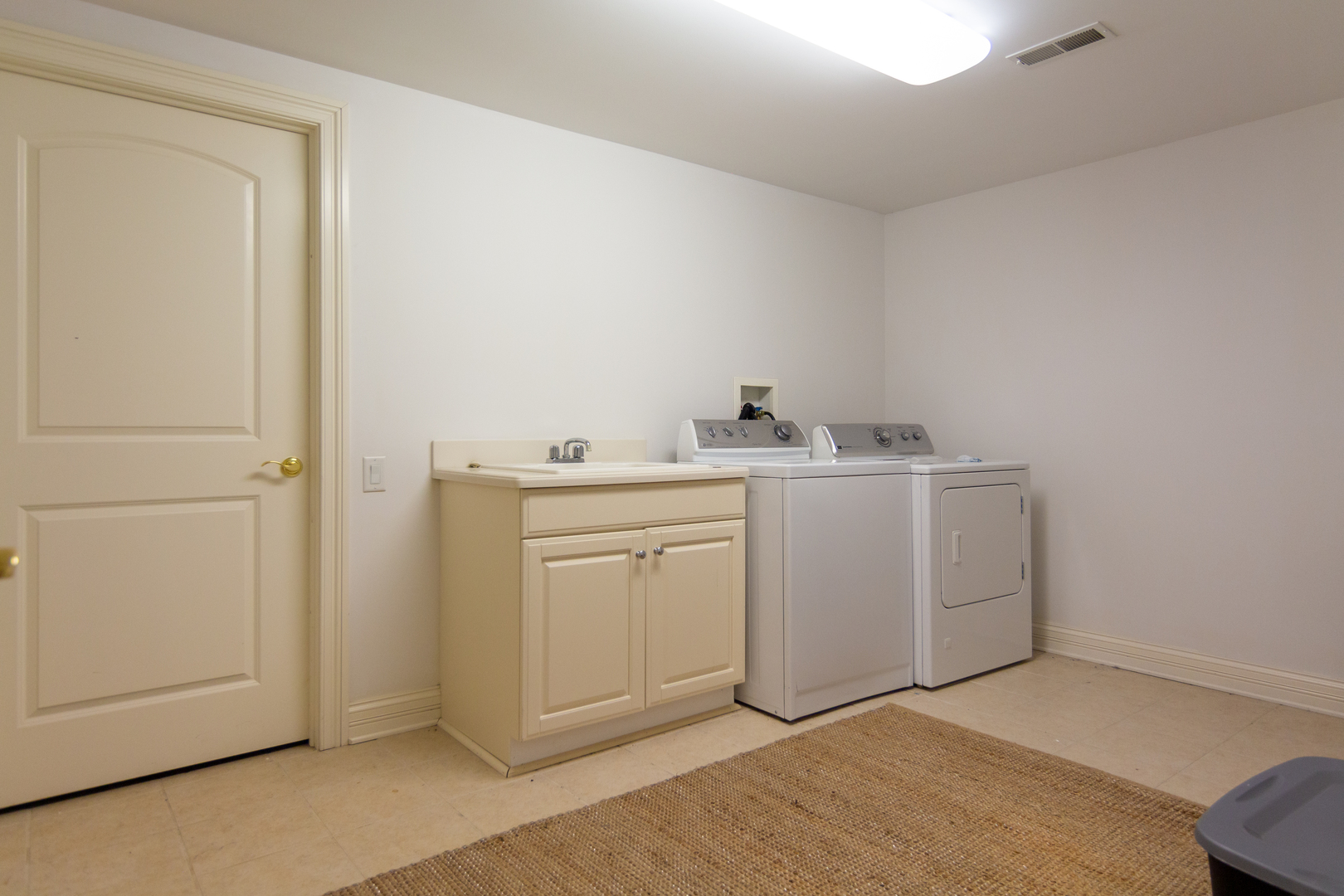 26 Willowcrest Drive Oak Brook, IL 60523 - Photo 11 of 17 a utility room with cabinets washer and dryer