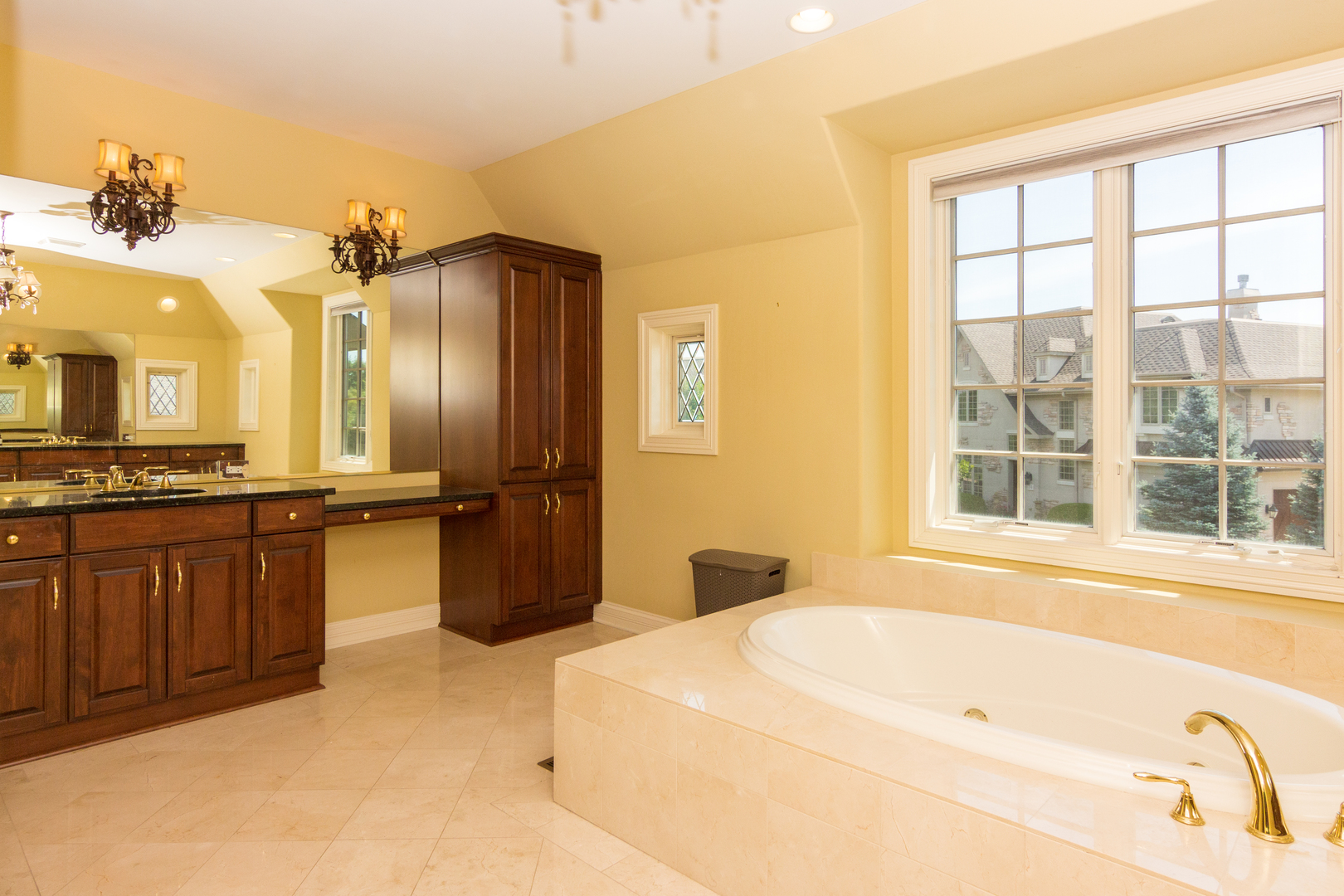 26 Willowcrest Drive Oak Brook, IL 60523 - Photo 7 of 17 a bathroom with a tub sink and a large mirror
