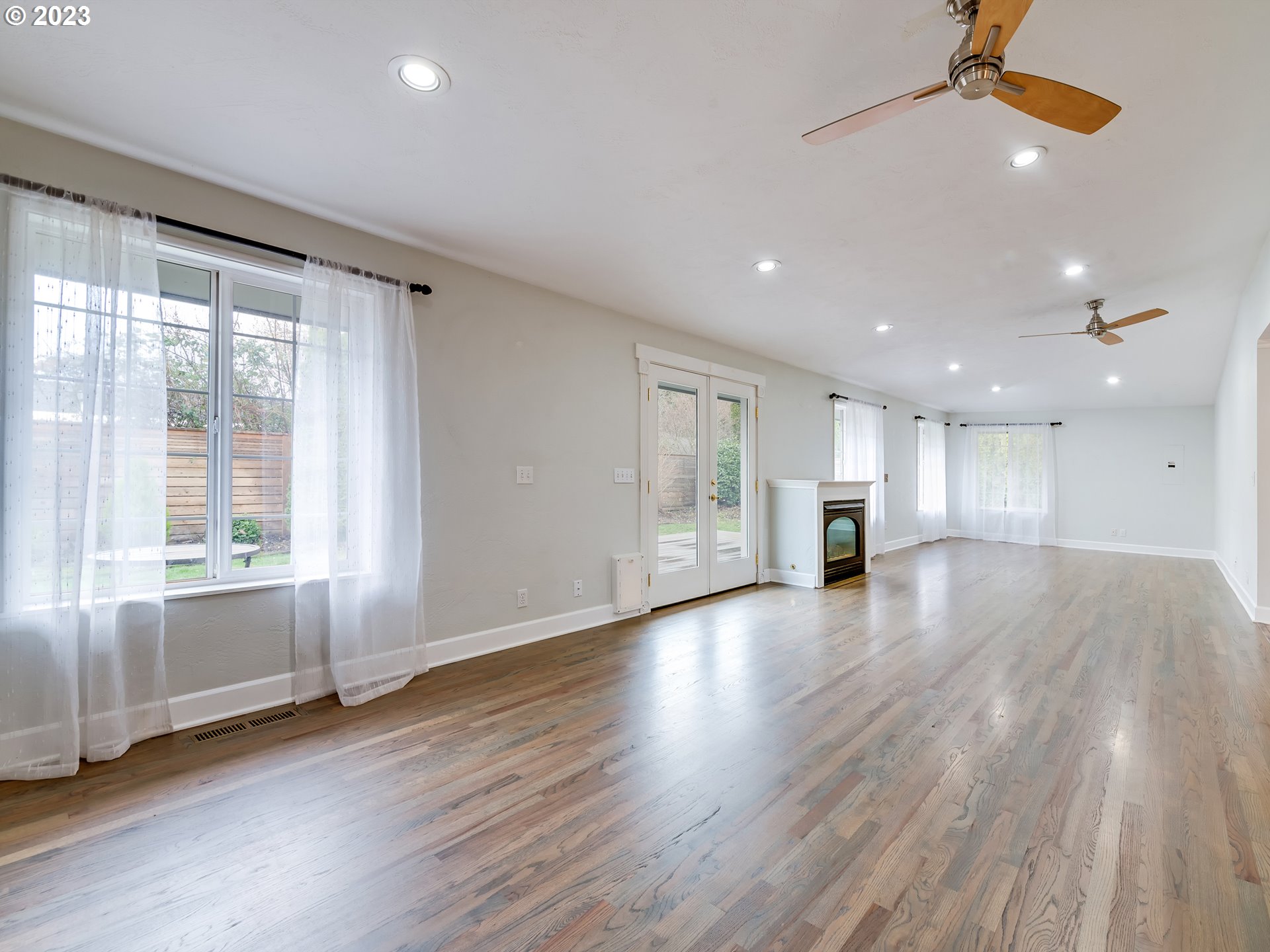 2552 Jasmine Street Eugene, OR 97404 - Photo 13 of 24 a view of an empty room with wooden floor and a window