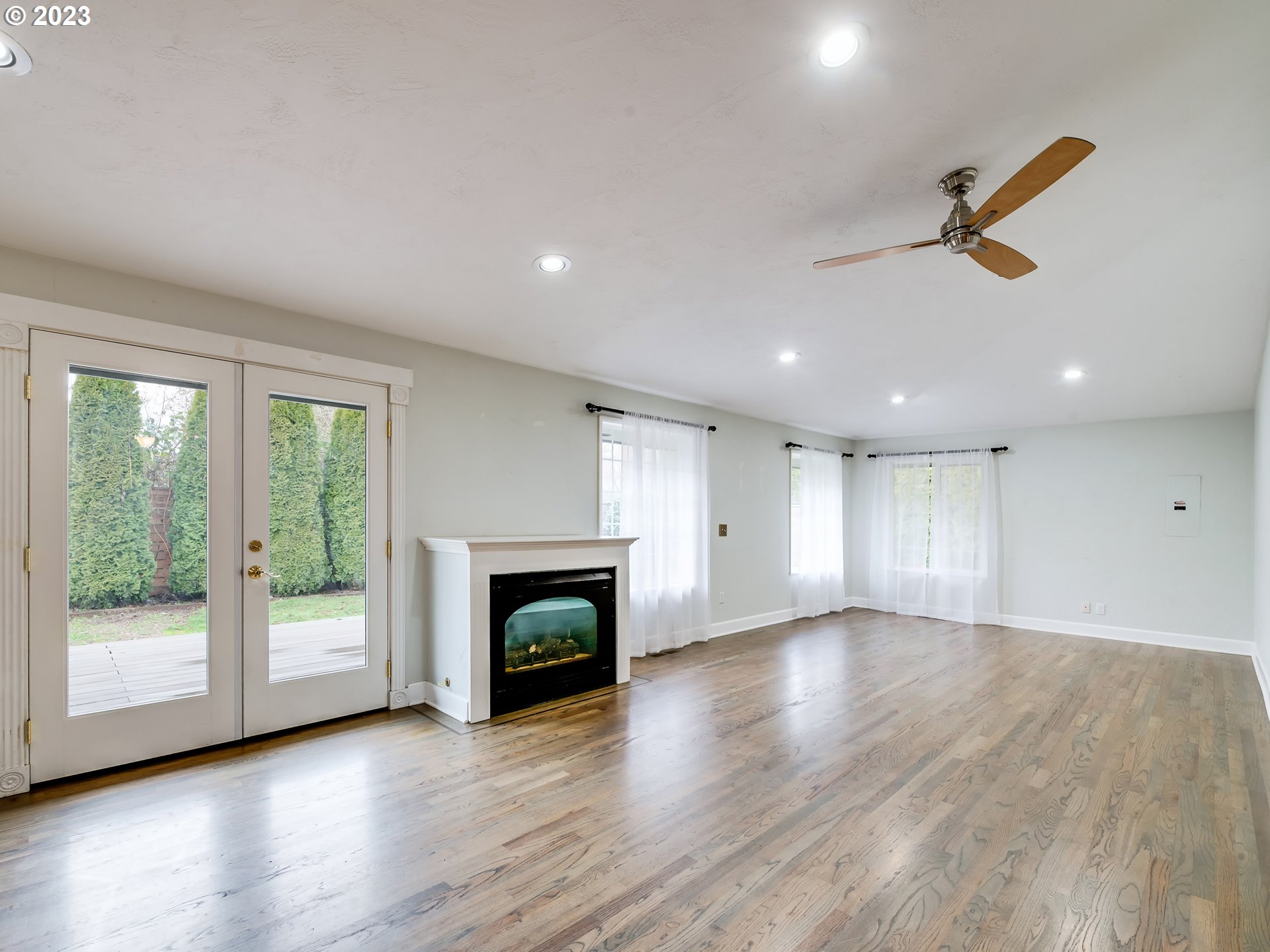 2552 Jasmine Street Eugene, OR 97404 - Photo 14 of 24 a view of an empty room with a fireplace and a window