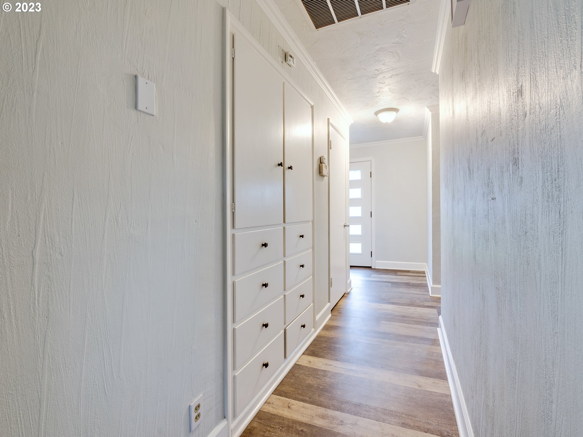 2552 Jasmine Street Eugene, OR 97404 - Photo 16 of 24 a view of a hallway with wooden floor