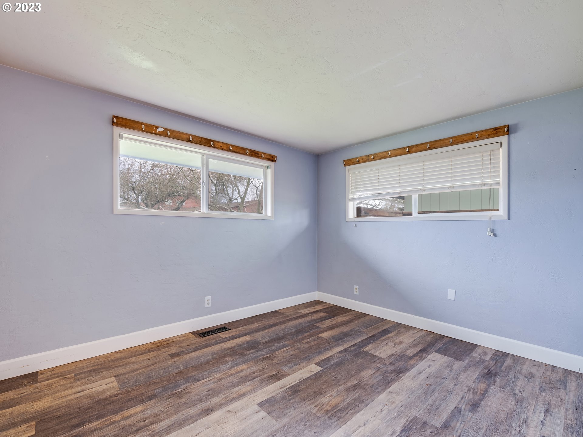 2552 Jasmine Street Eugene, OR 97404 - Photo 18 of 24 a view of empty room with wooden floor and fan