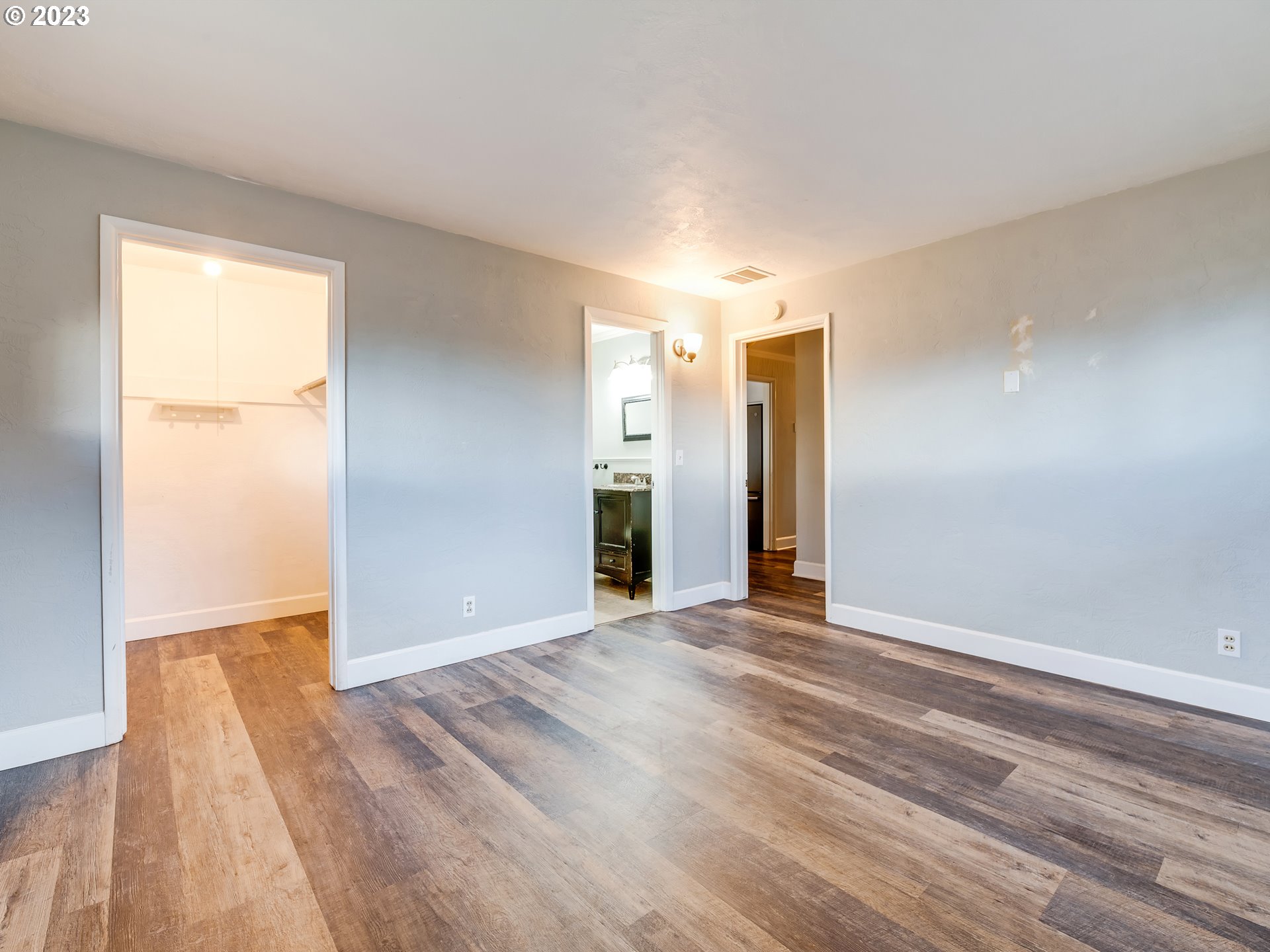 2552 Jasmine Street Eugene, OR 97404 - Photo 19 of 24 a view of an empty room with wooden floor