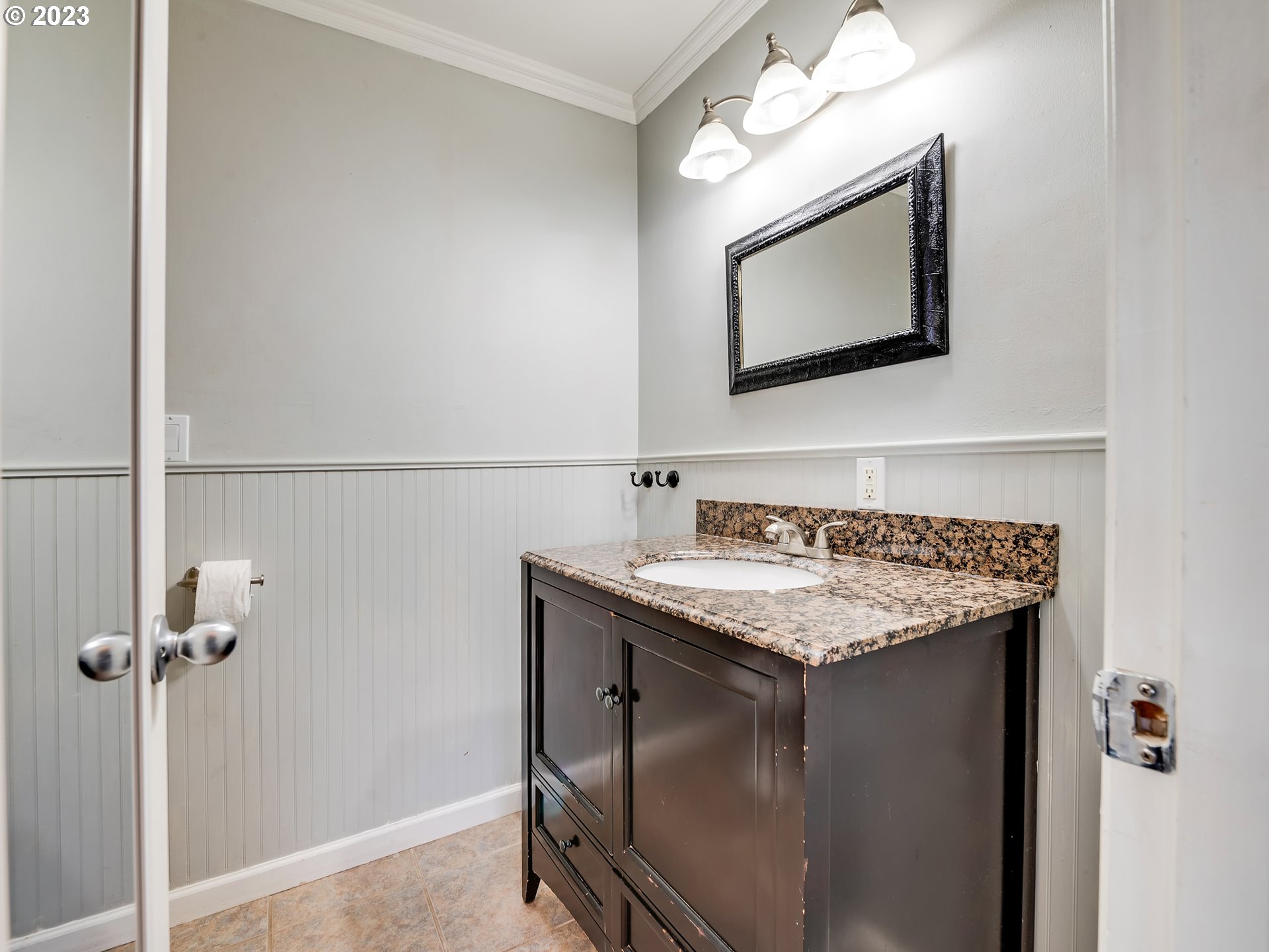 2552 Jasmine Street Eugene, OR 97404 - Photo 21 of 24 a bathroom with a granite countertop sink and a mirror