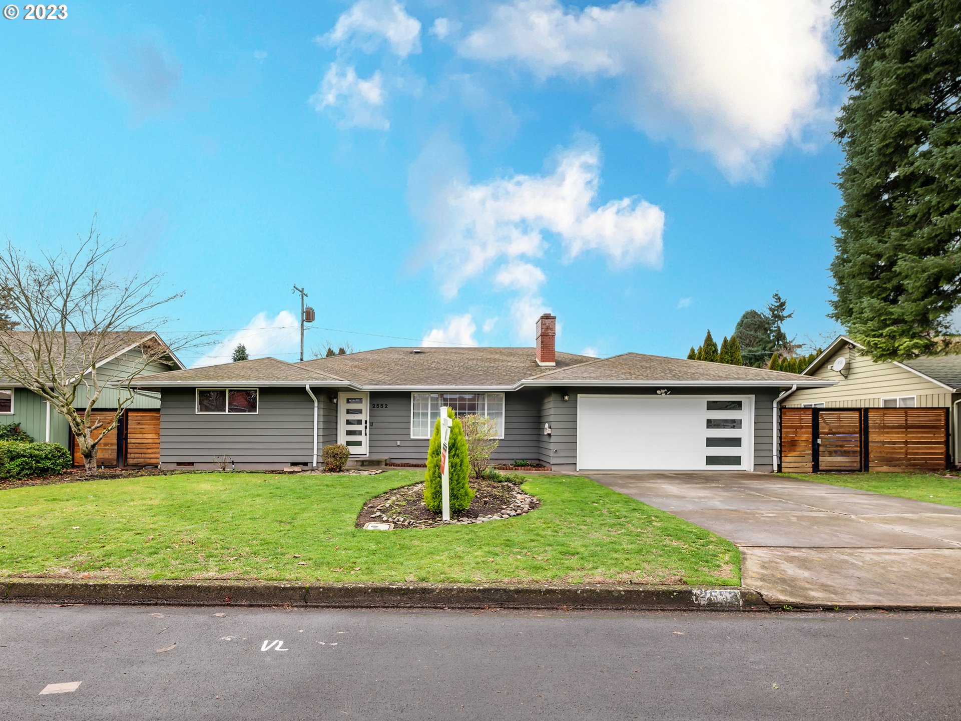 2552 Jasmine Street Eugene, OR 97404 - Photo 3 of 24 a front view of a house with a garden and plants