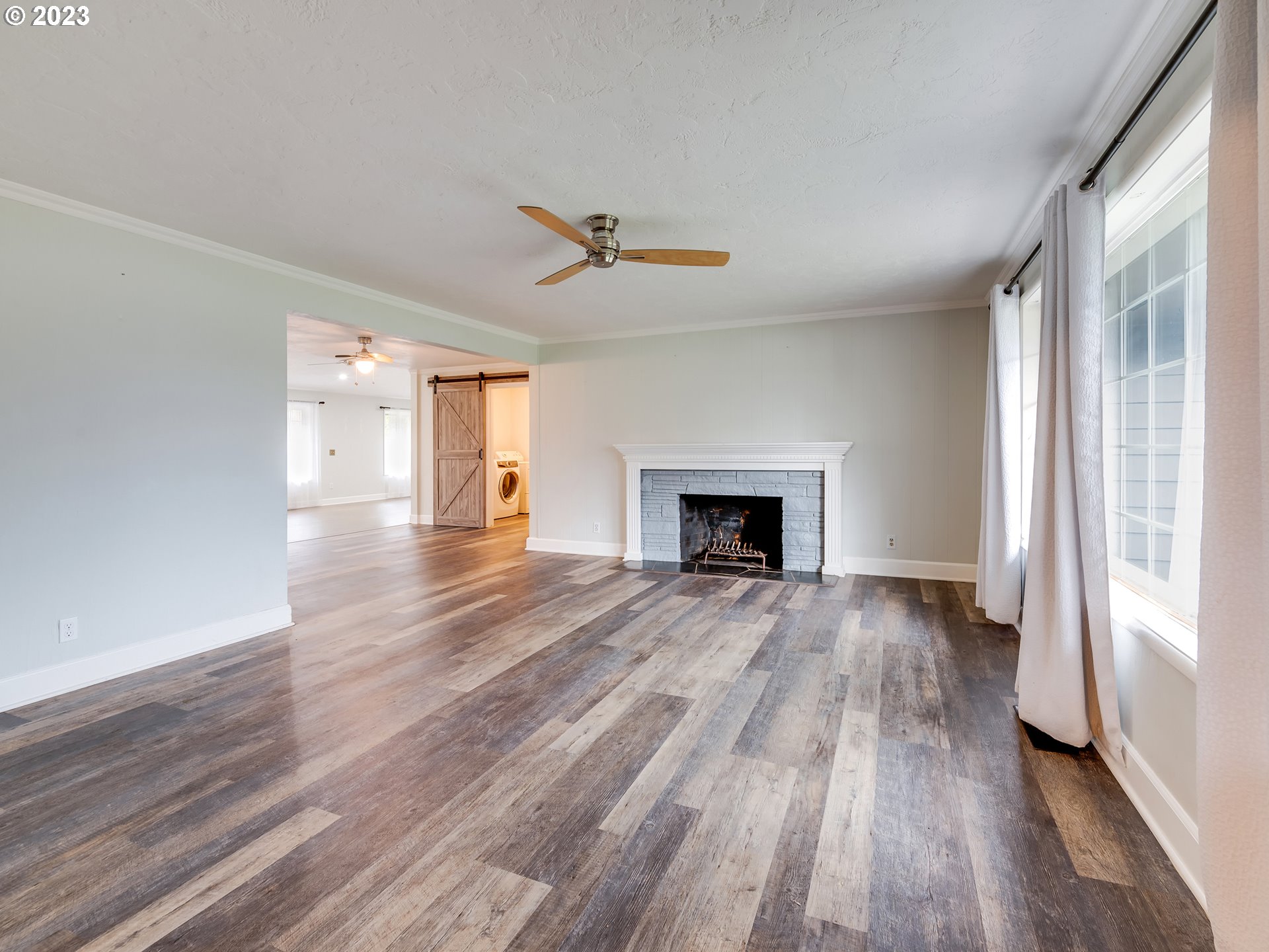 2552 Jasmine Street Eugene, OR 97404 - Photo 5 of 24 wooden floor fireplace and natural light in room
