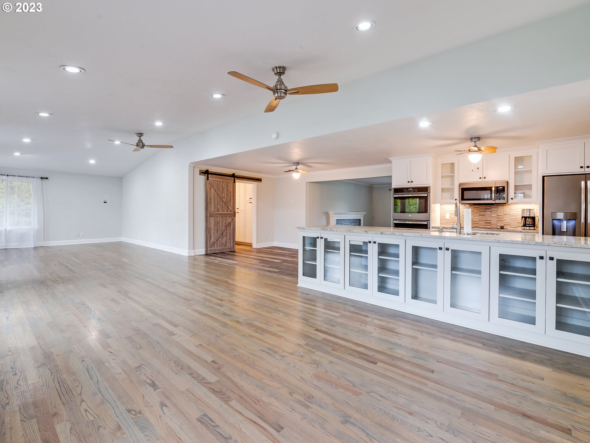 2552 Jasmine Street Eugene, OR 97404 - Photo 6 of 24 a living room with stainless steel appliances kitchen island wooden floors and view living room