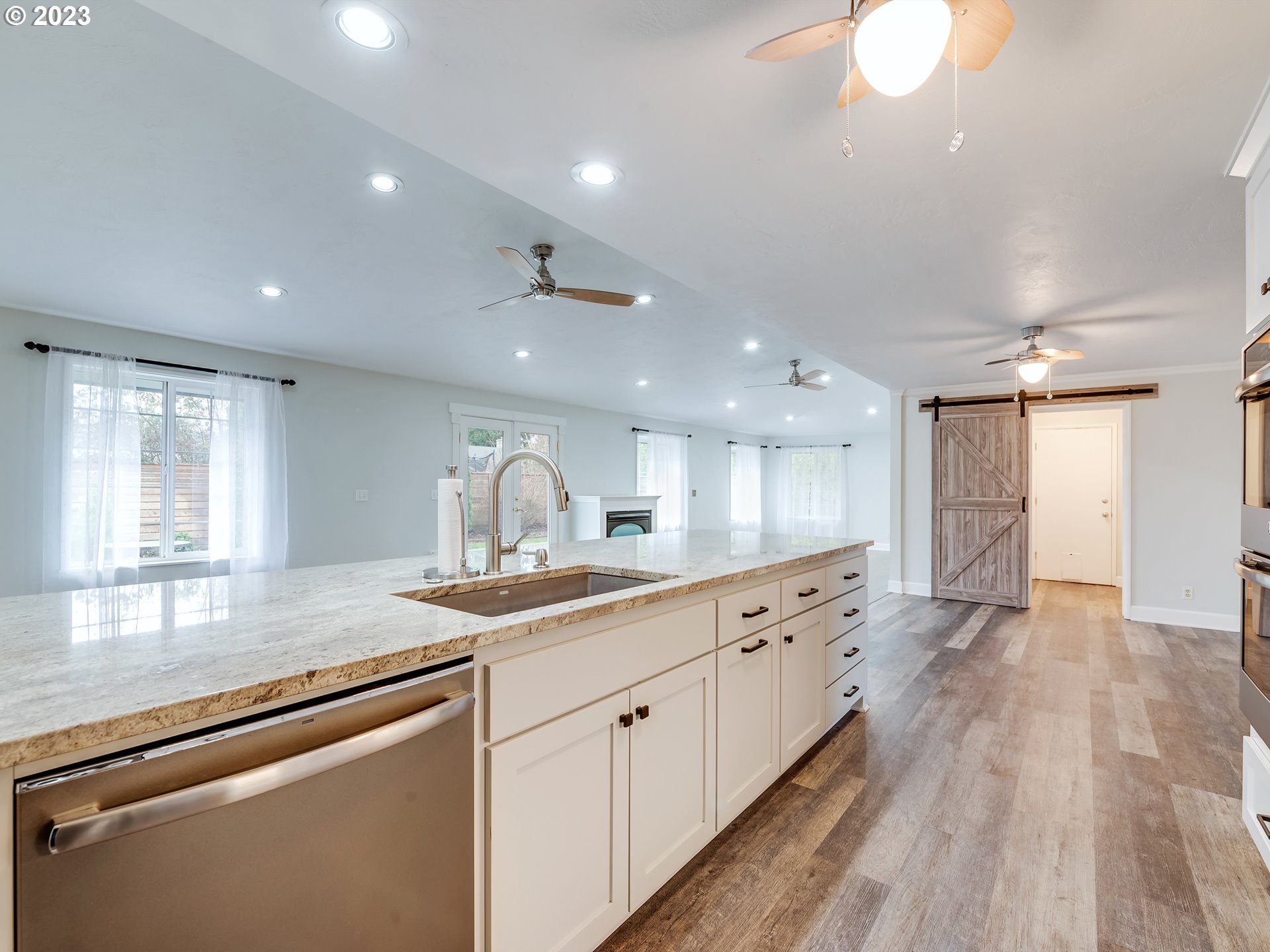 2552 Jasmine Street Eugene, OR 97404 - Photo 9 of 24 a kitchen with a sink microwave and cabinets