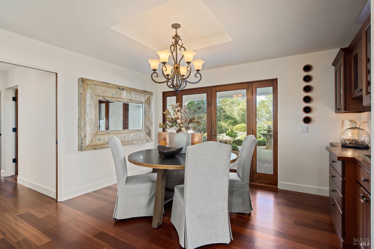 2405 Lewis Road Sebastopol, CA 95472 - Photo 28 of 58 a view of a dining room with furniture a chandelier and wooden floor