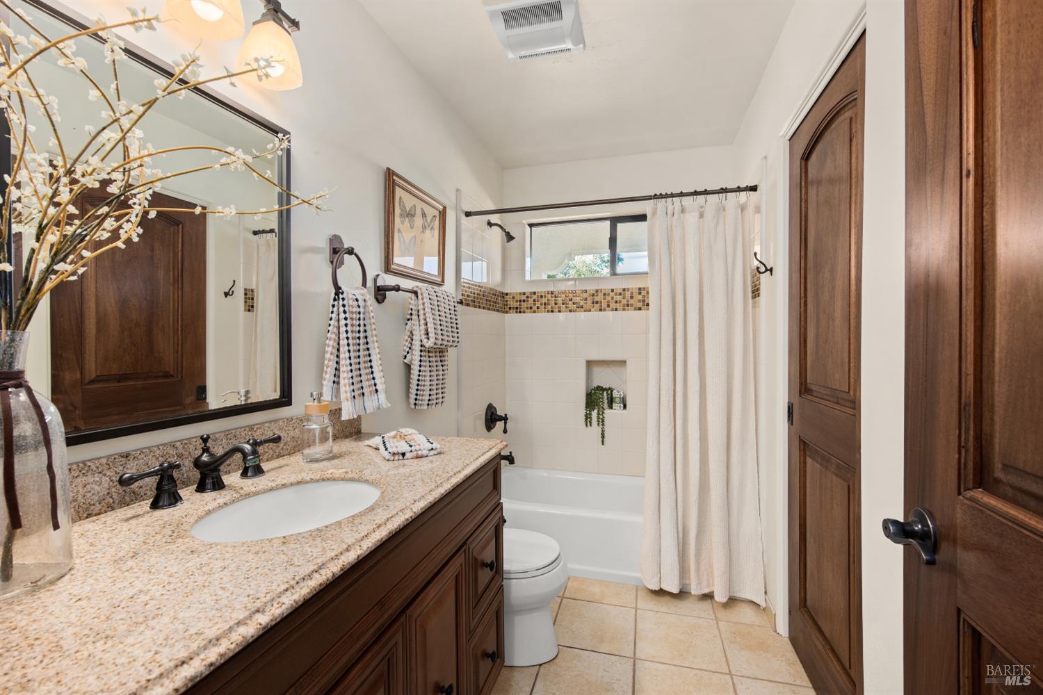 2405 Lewis Road Sebastopol, CA 95472 - Photo 33 of 58 a bathroom with a granite countertop sink toilet and shower