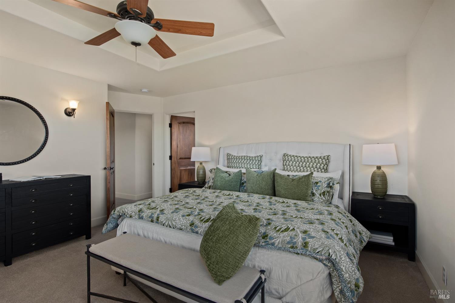 2405 Lewis Road Sebastopol, CA 95472 - Photo 43 of 58 a bedroom with a large bed and a chandelier