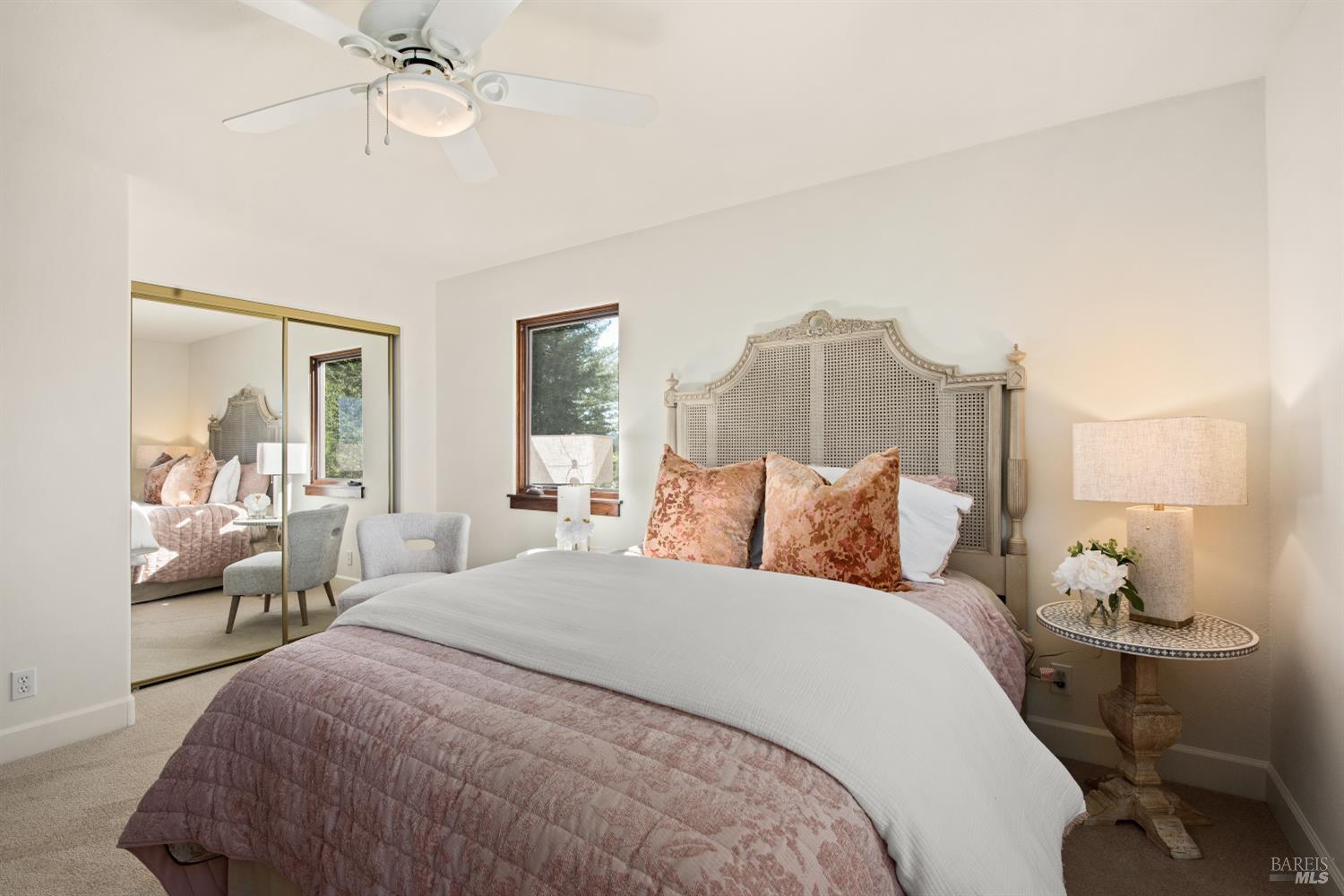 2405 Lewis Road Sebastopol, CA 95472 - Photo 52 of 58 a bed room with a bed and a chandelier