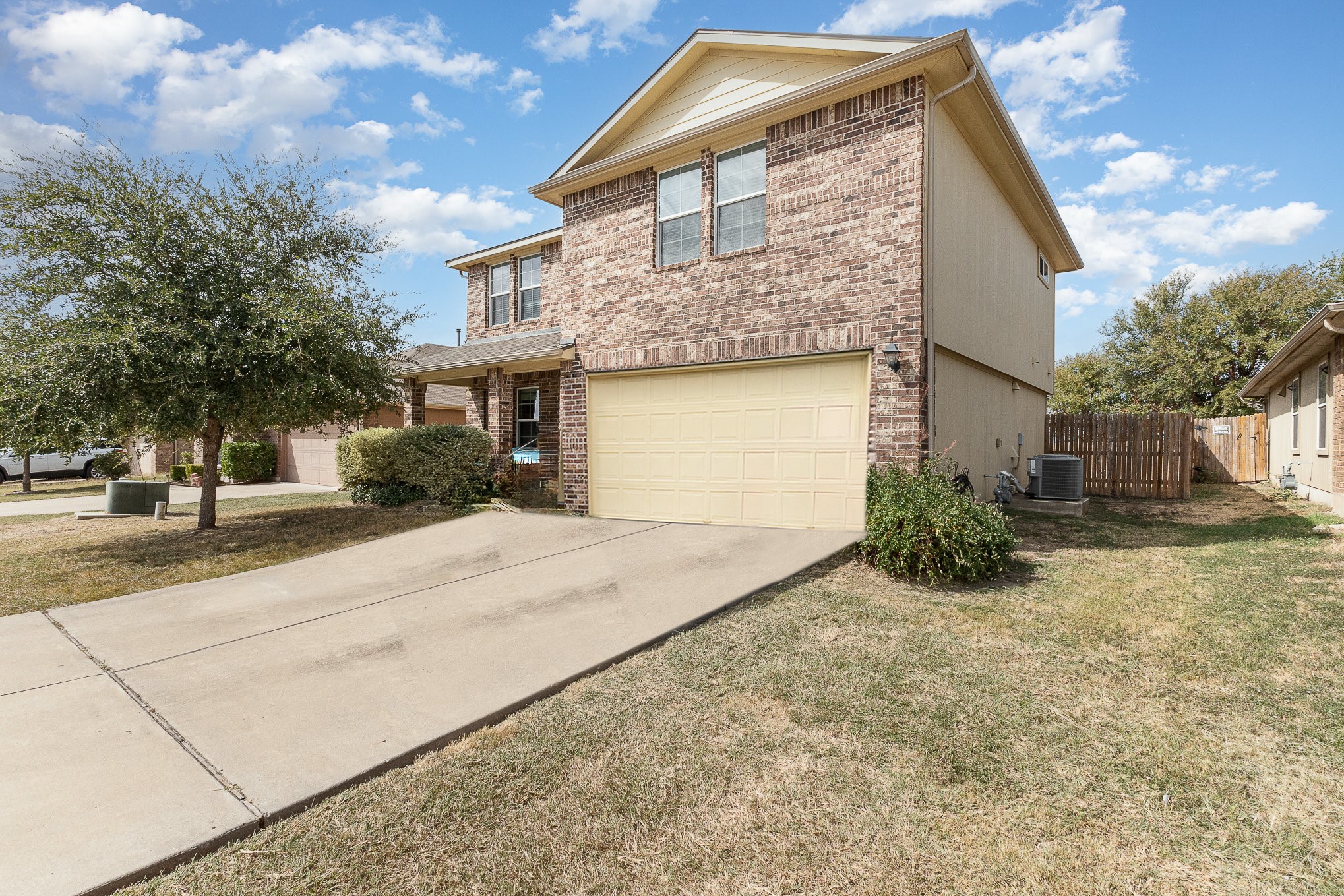 13708 Sierra Wind Lane Elgin, TX 78621 - Photo 1 of 1 a front view of a house with a yard