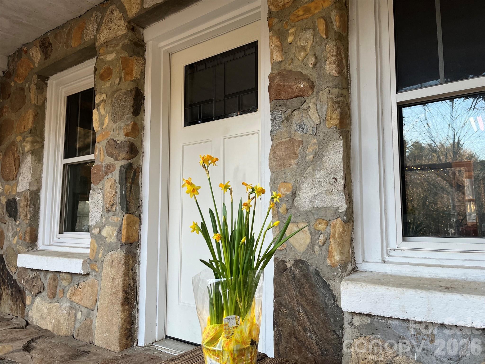 86 R And R Hyder Lane Hendersonville, NC 28792 - Photo 2 of 8 a view of a potted plant in front of a door