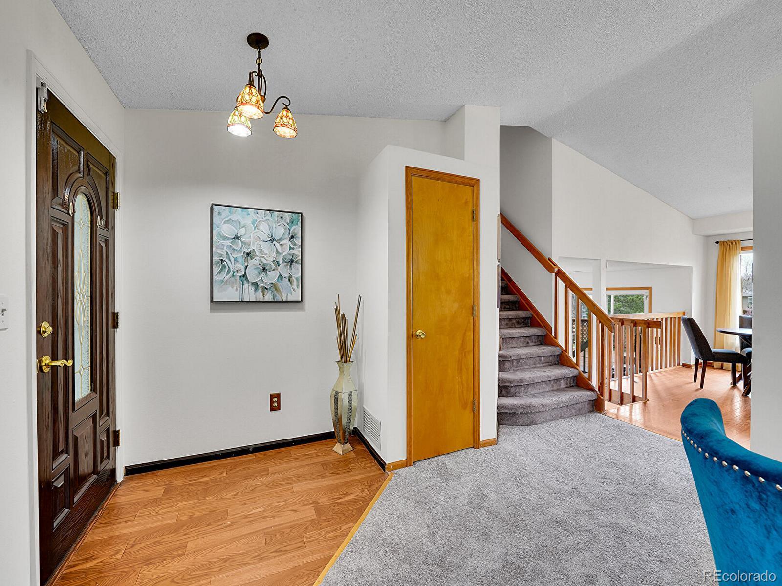 6343 Laguna Circle Highlands Ranch, CO 80130 - Photo 13 of 43 a view of a livingroom with furniture and staircase