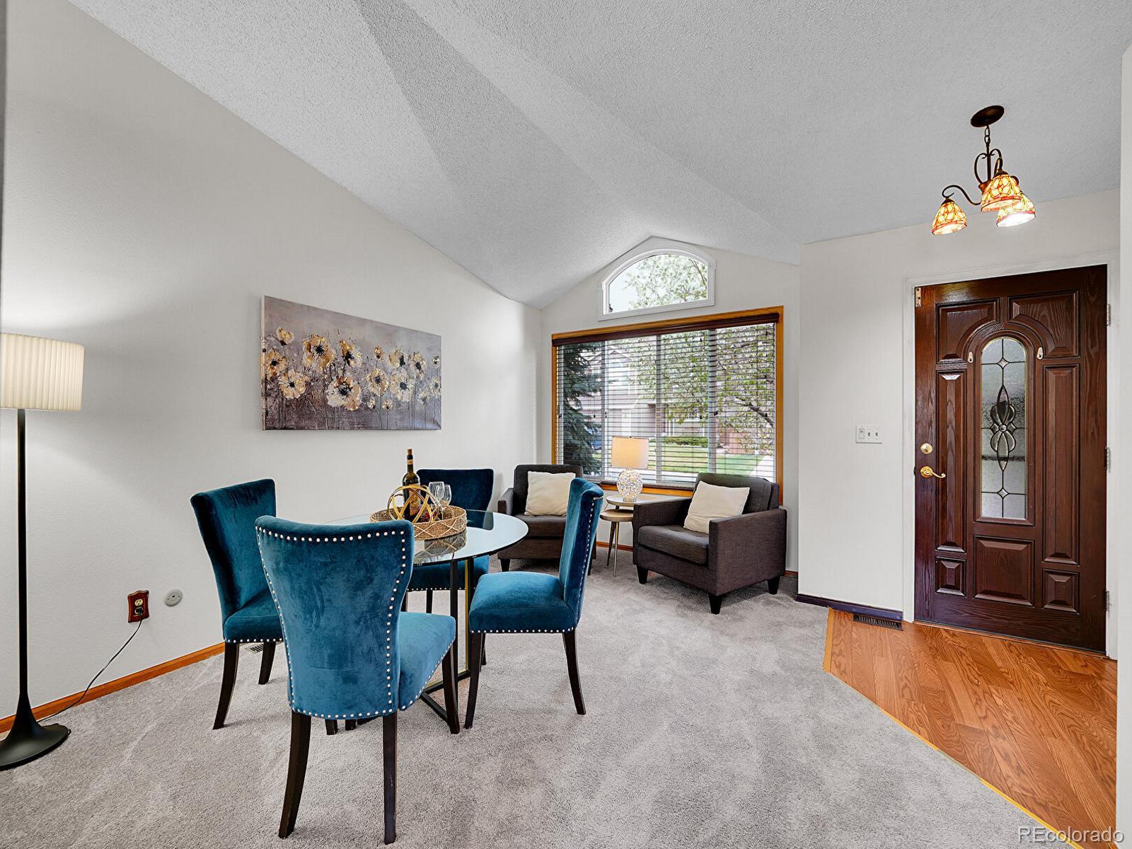 6343 Laguna Circle Highlands Ranch, CO 80130 - Photo 14 of 43 a view of a dining room with furniture window and wooden floor