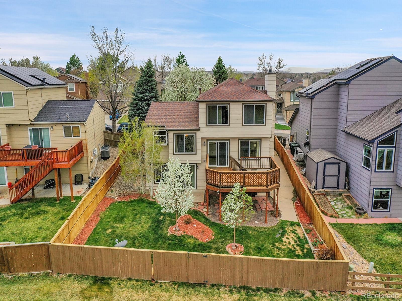 6343 Laguna Circle Highlands Ranch, CO 80130 - Photo 2 of 43 front view of a house with a yard