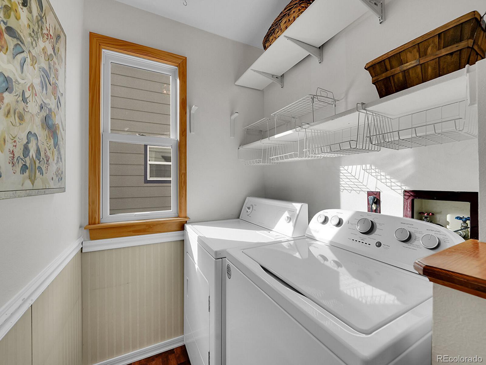 6343 Laguna Circle Highlands Ranch, CO 80130 - Photo 21 of 43 a utility room with dryer and washer