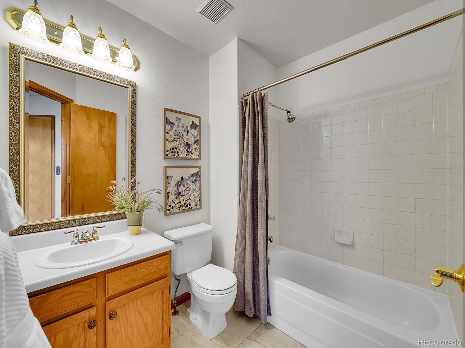 6343 Laguna Circle Highlands Ranch, CO 80130 - Photo 25 of 43 a bathroom with a sink toilet and shower