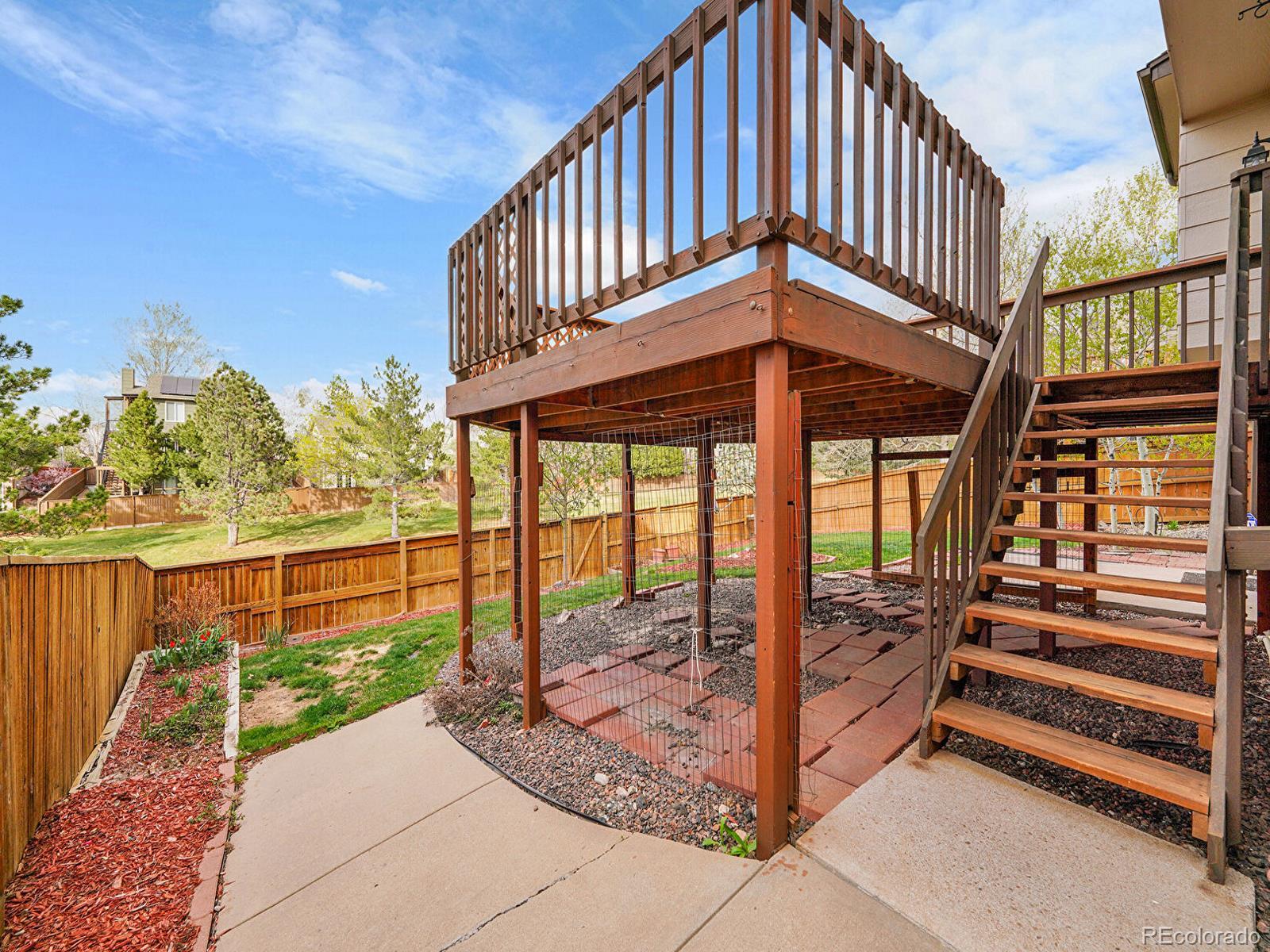 6343 Laguna Circle Highlands Ranch, CO 80130 - Photo 31 of 43 a view of a porch with a yard