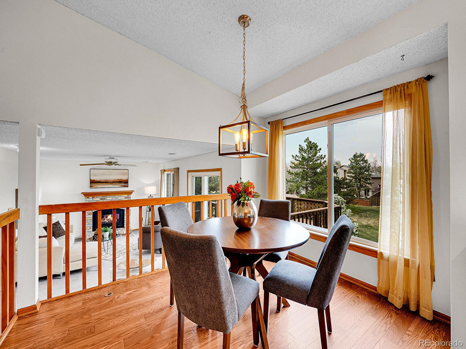6343 Laguna Circle Highlands Ranch, CO 80130 - Photo 5 of 43 a dining room with furniture window wooden floor