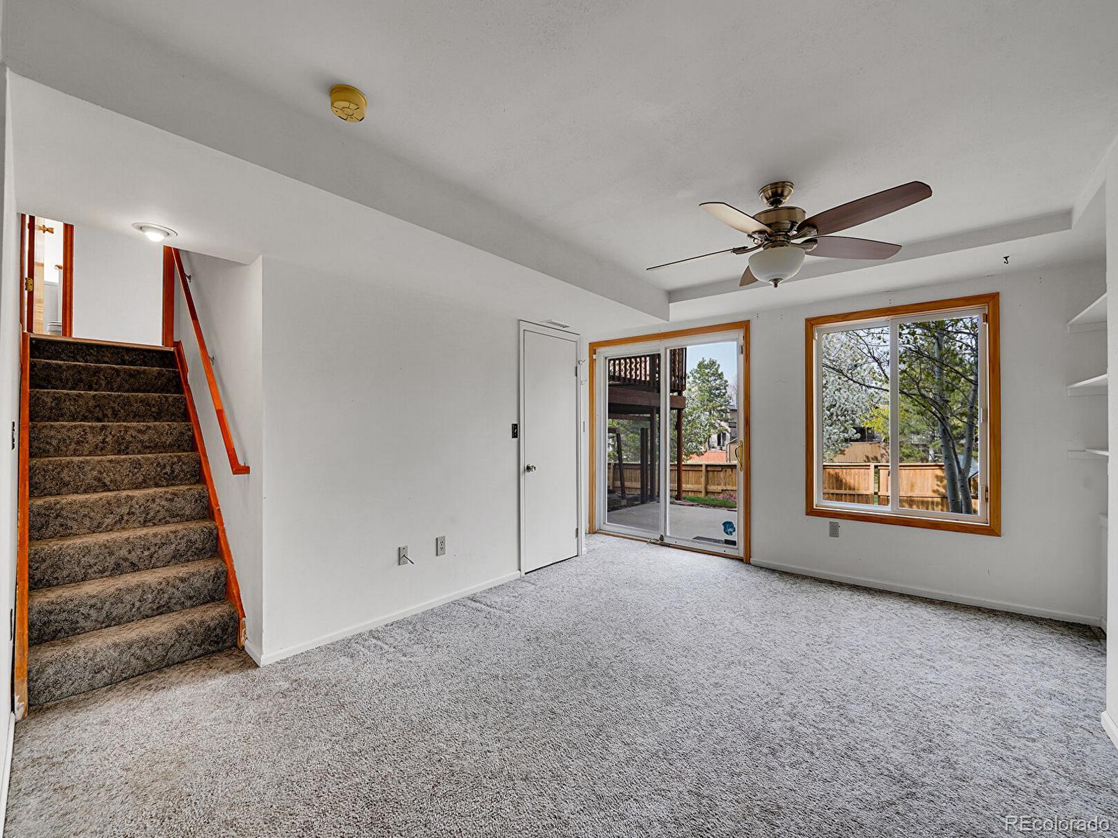 6343 Laguna Circle Highlands Ranch, CO 80130 - Photo 9 of 43 wooden floor in an empty room with a window