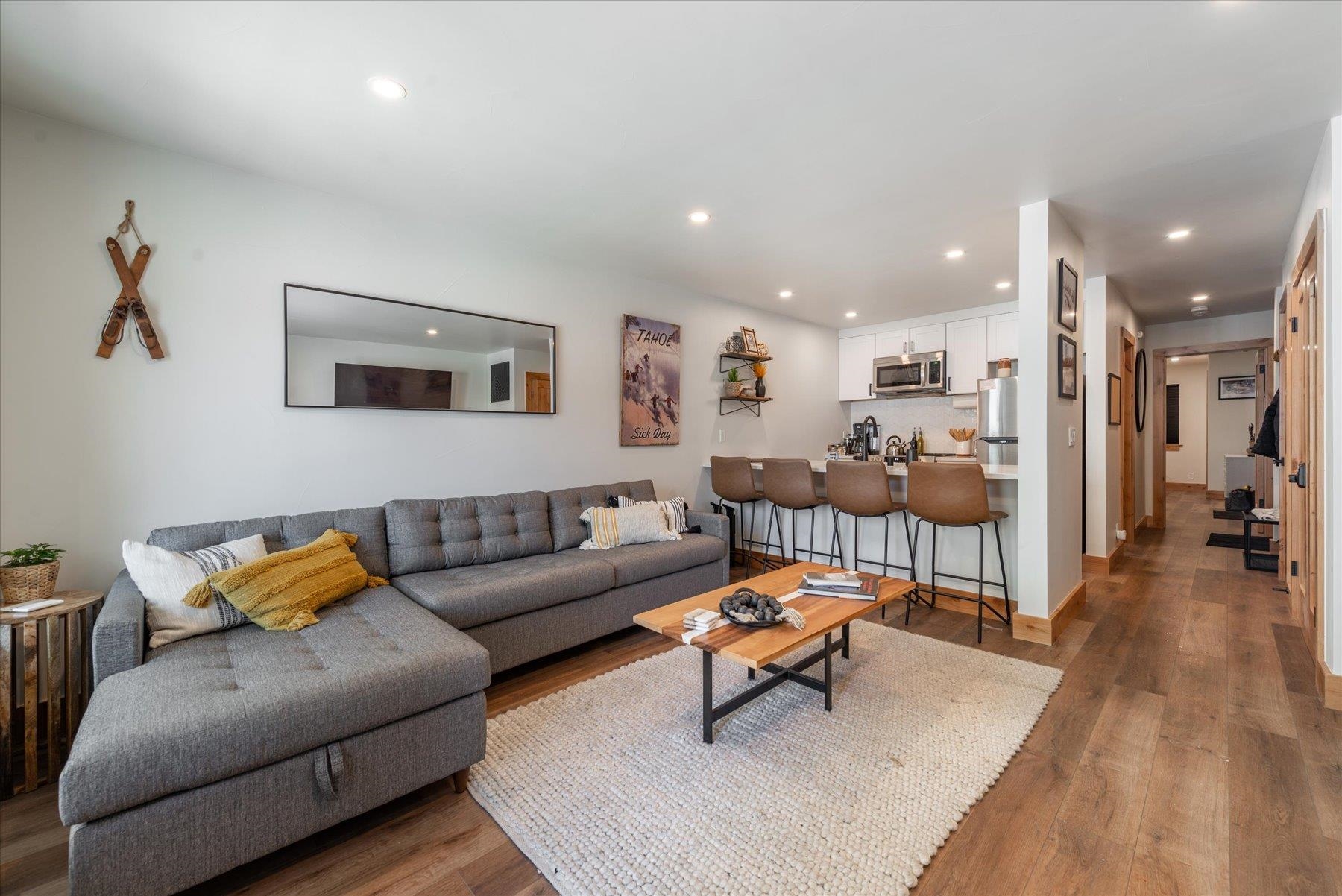 10150 Ski Ranch Lane, Unit 210 Soda Springs, CA 95728 - Photo 1 of 24 a living room with furniture and a wooden floor
