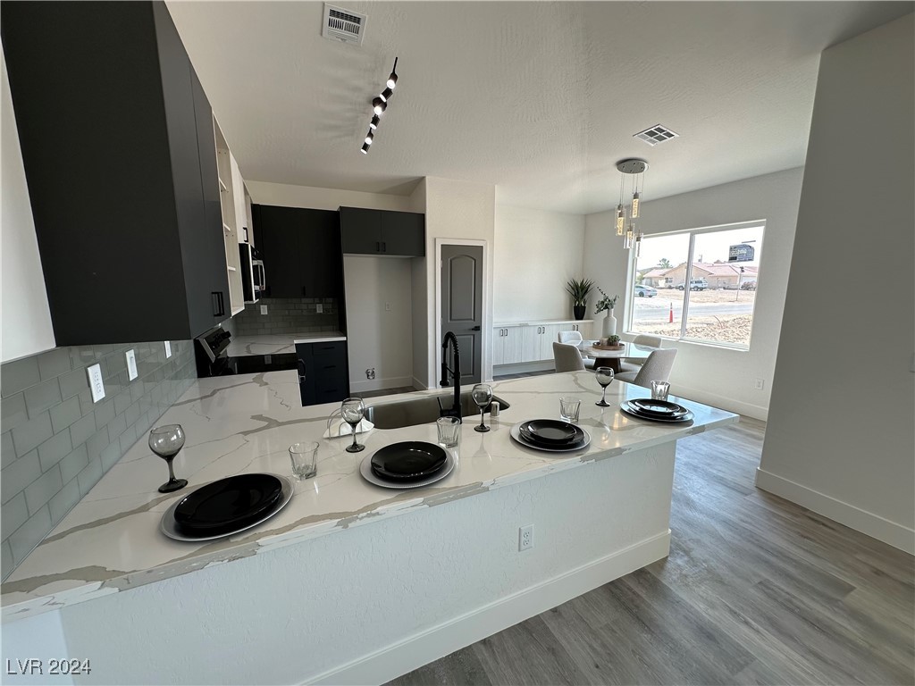 971 Jack Rabbit Street Pahrump, NV 89048 - Photo 35 of 35 Open great room floorplan with dedicated dining area off kitchen