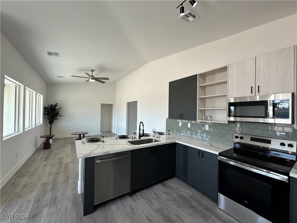 971 Jack Rabbit Street Pahrump, NV 89048 - Photo 3 of 35 Breakfast bar and vaulted ceiling's make truly open living space