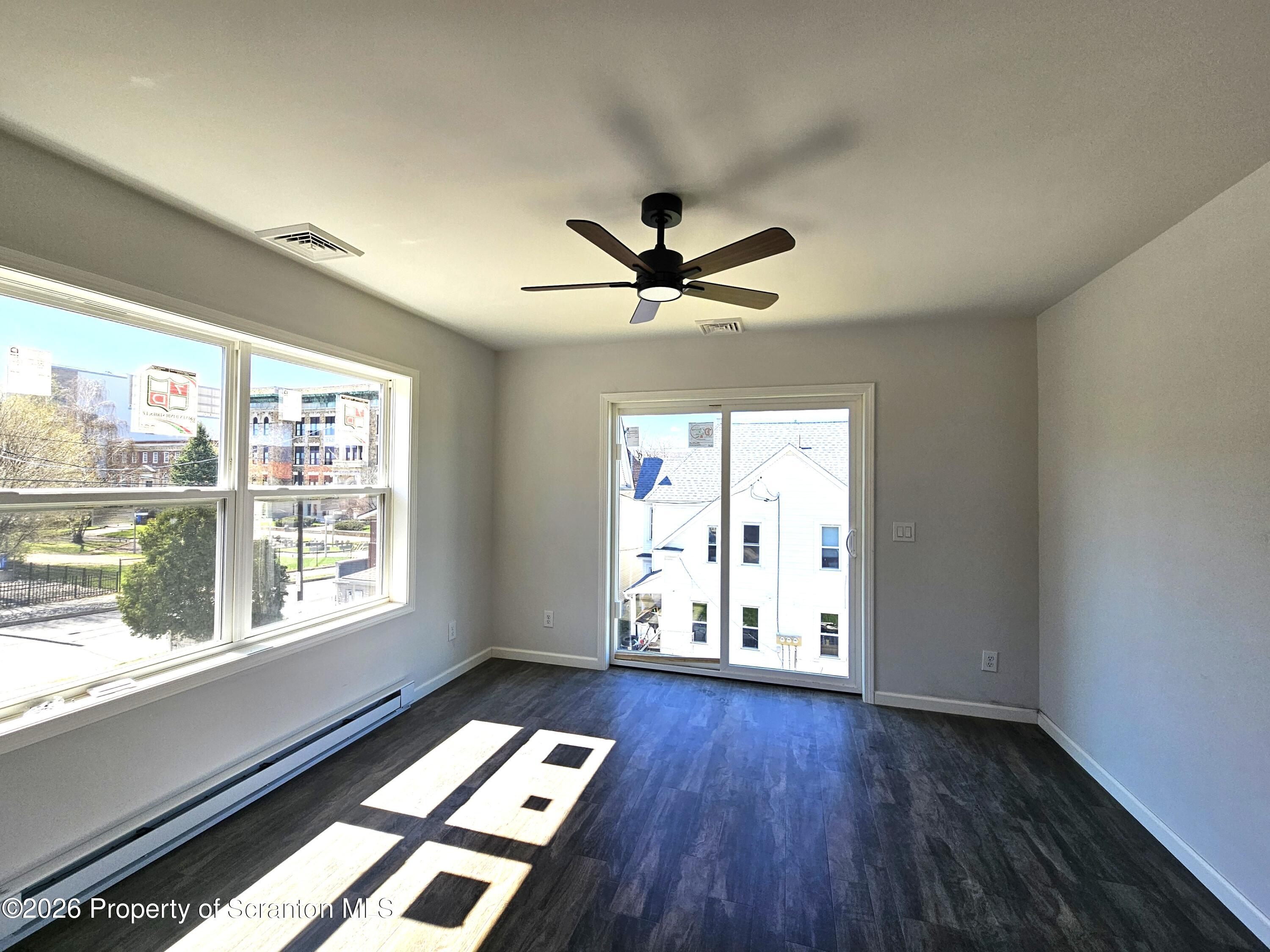 609 East Gibson Street, Unit 1 Scranton, PA 18510 - Photo 6 of 9 a very nice looking room with wooden floor and a window