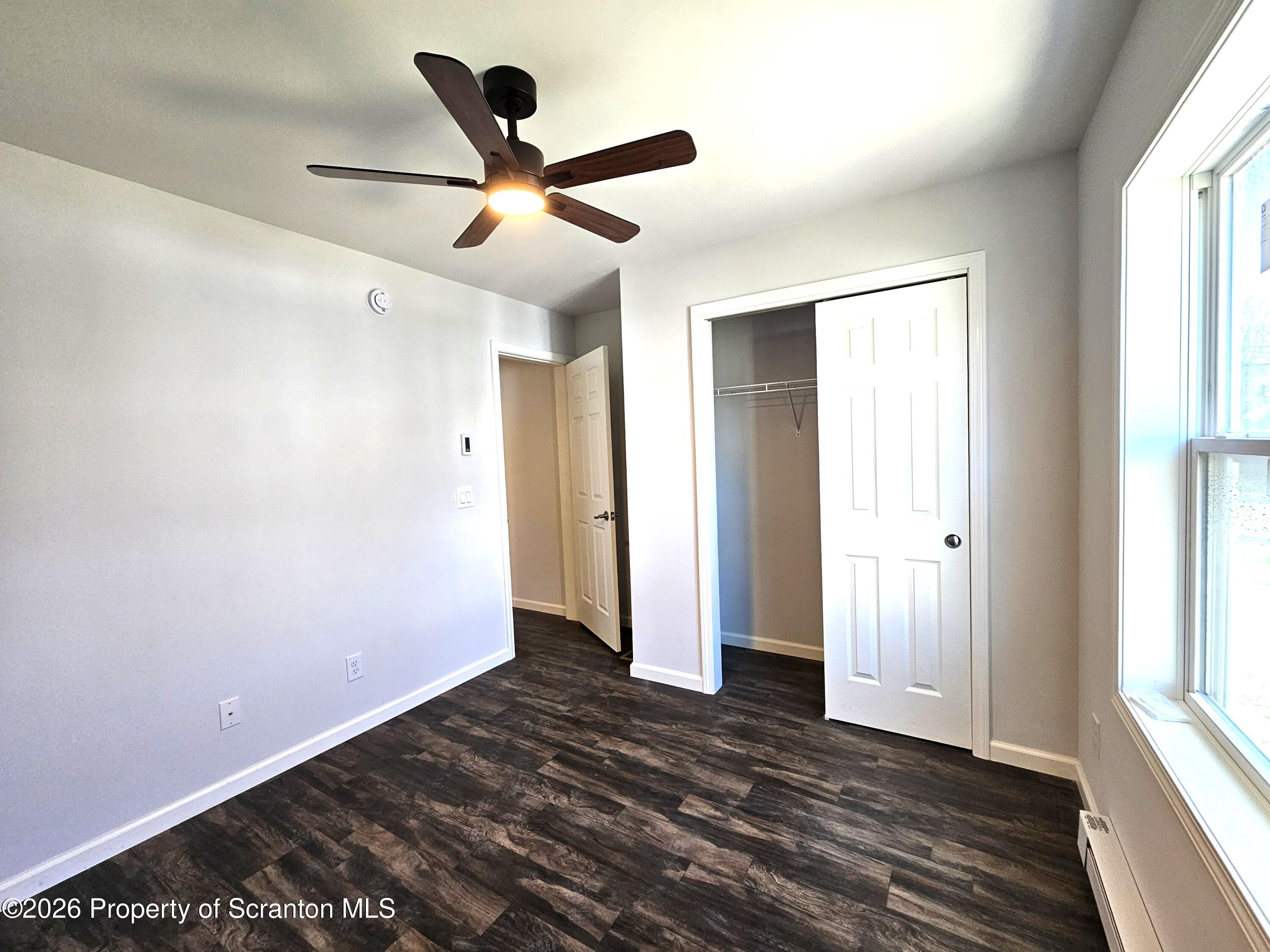 609 East Gibson Street, Unit 1 Scranton, PA 18510 - Photo 7 of 9 wooden floor in an empty room with a window