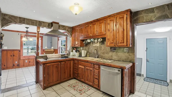 a kitchen with a sink and cabinets