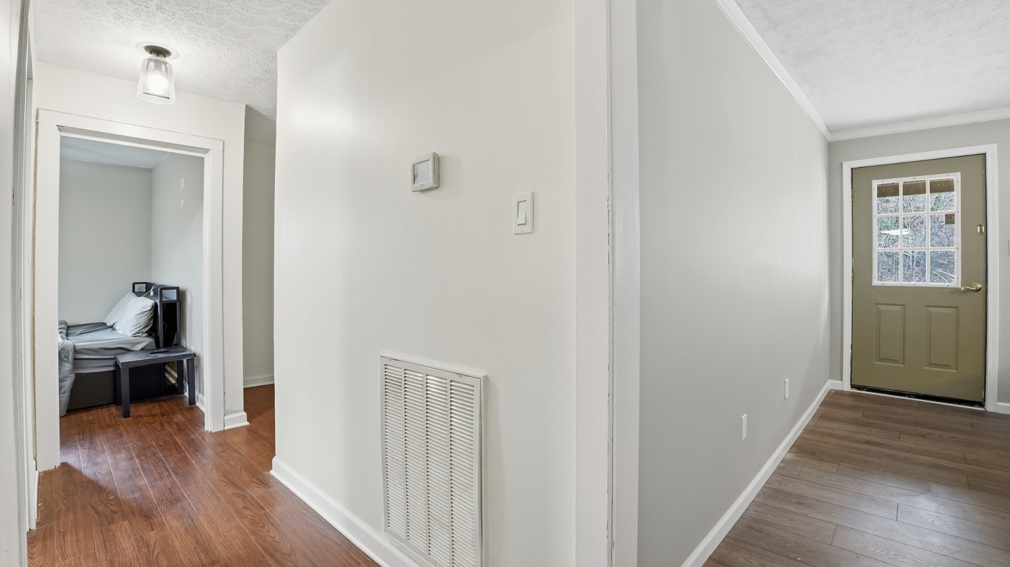 7610 Highway 50 Pelham, TN 37366 - Photo 18 of 46 a view of a hallway with wooden floor and a bedroom